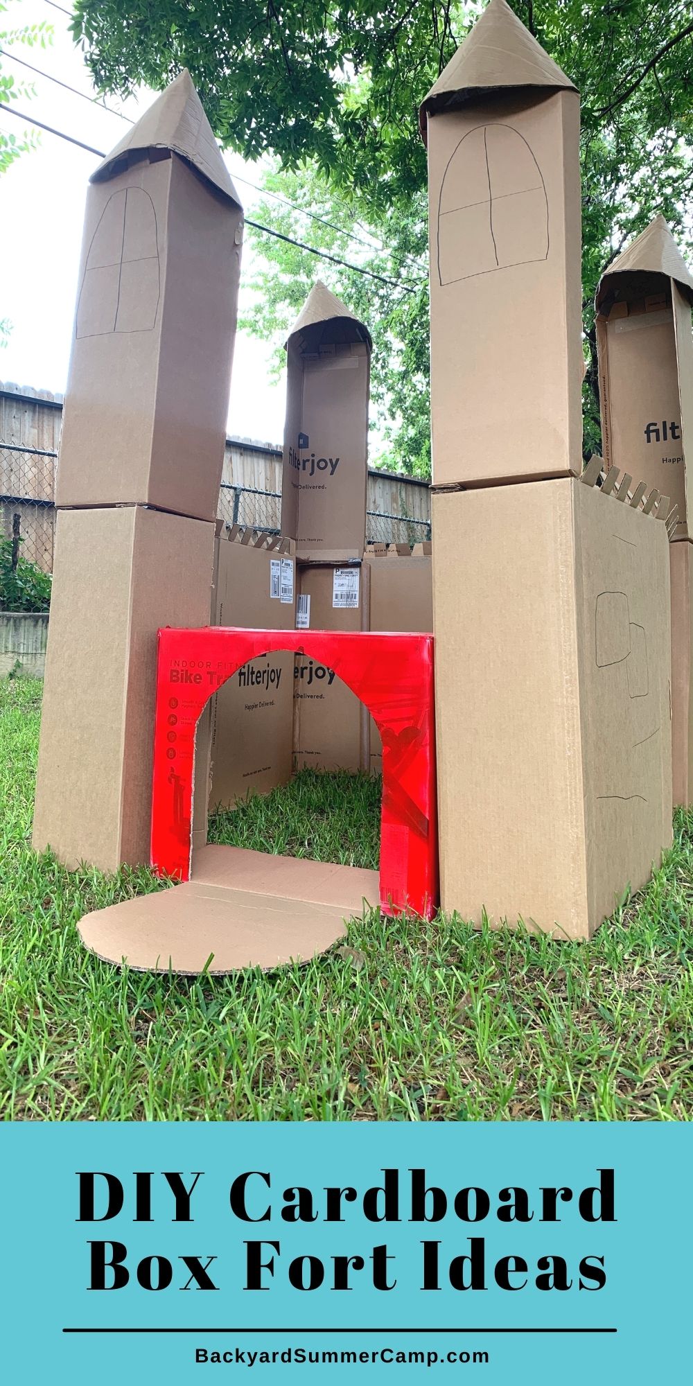 DIY cardboard box fort idea using boxes in different sizes cut into walls and towers.