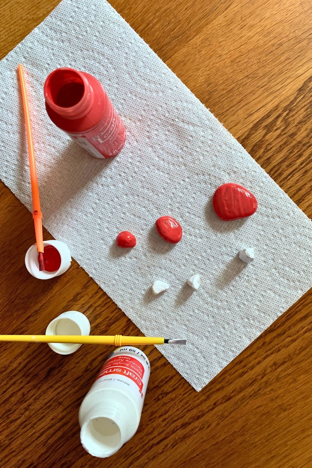 Paint and rocks painted red and white.