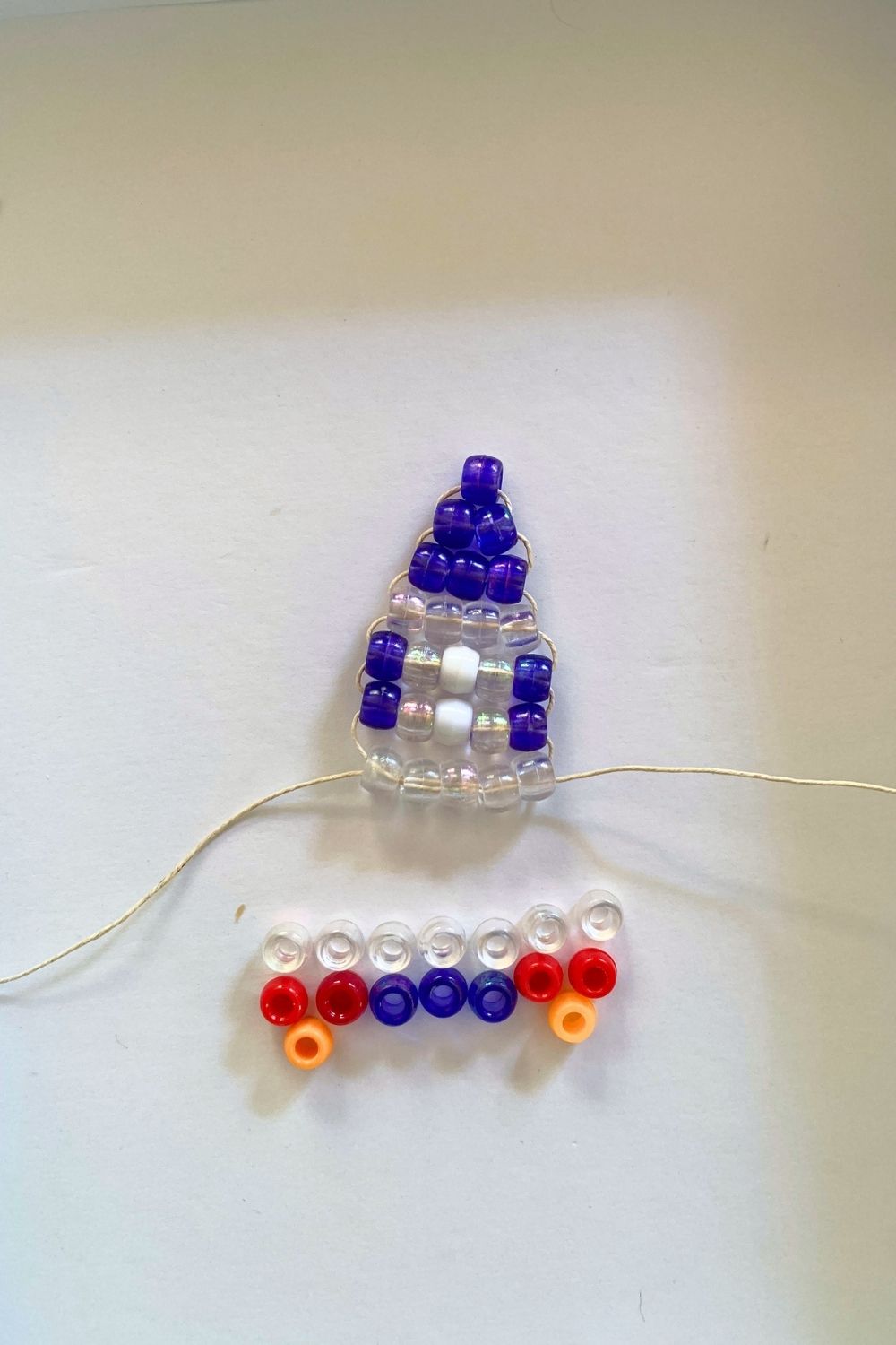 Row 7 with 5 clear beads.