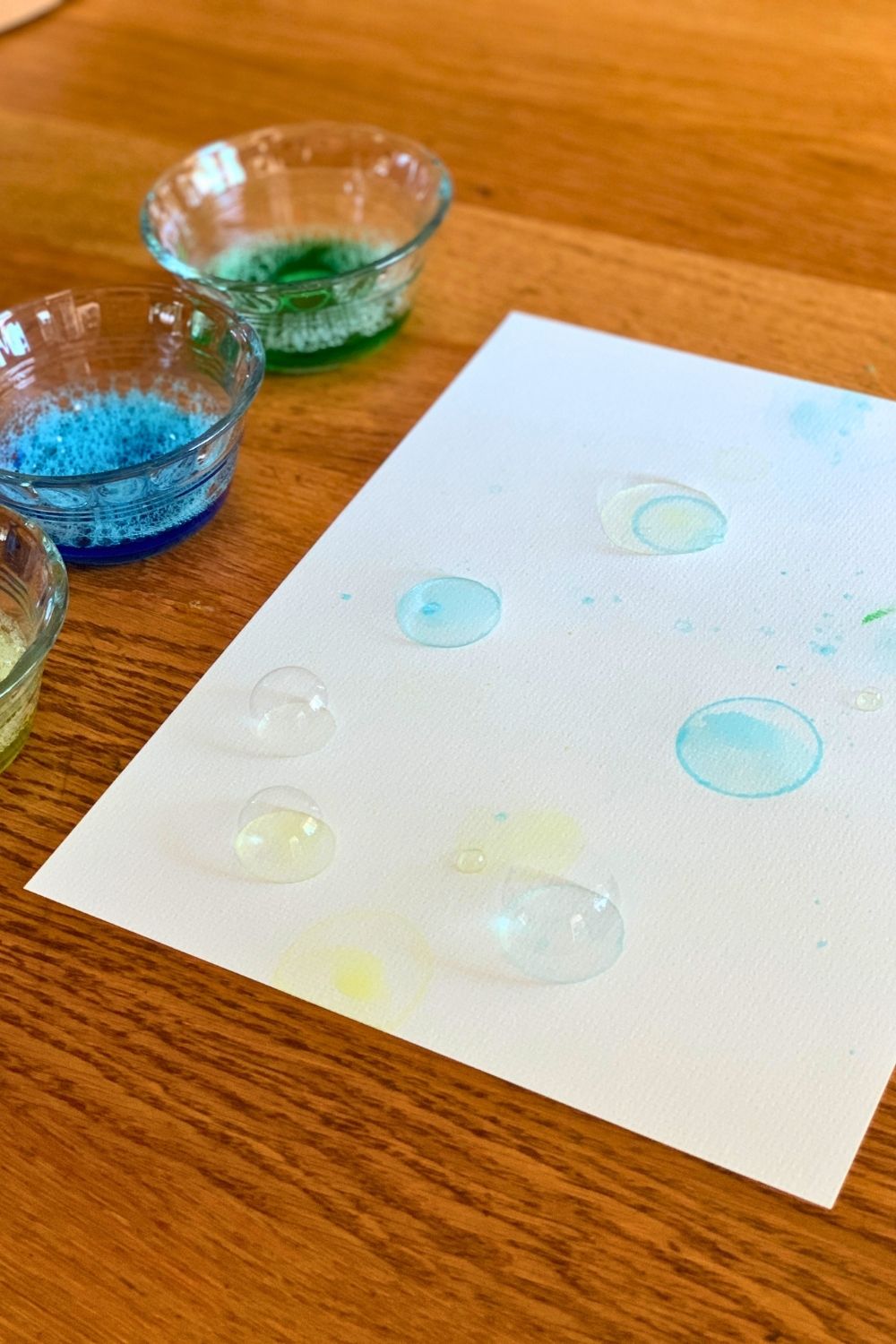 Soap bubbles and colored circles on paper.