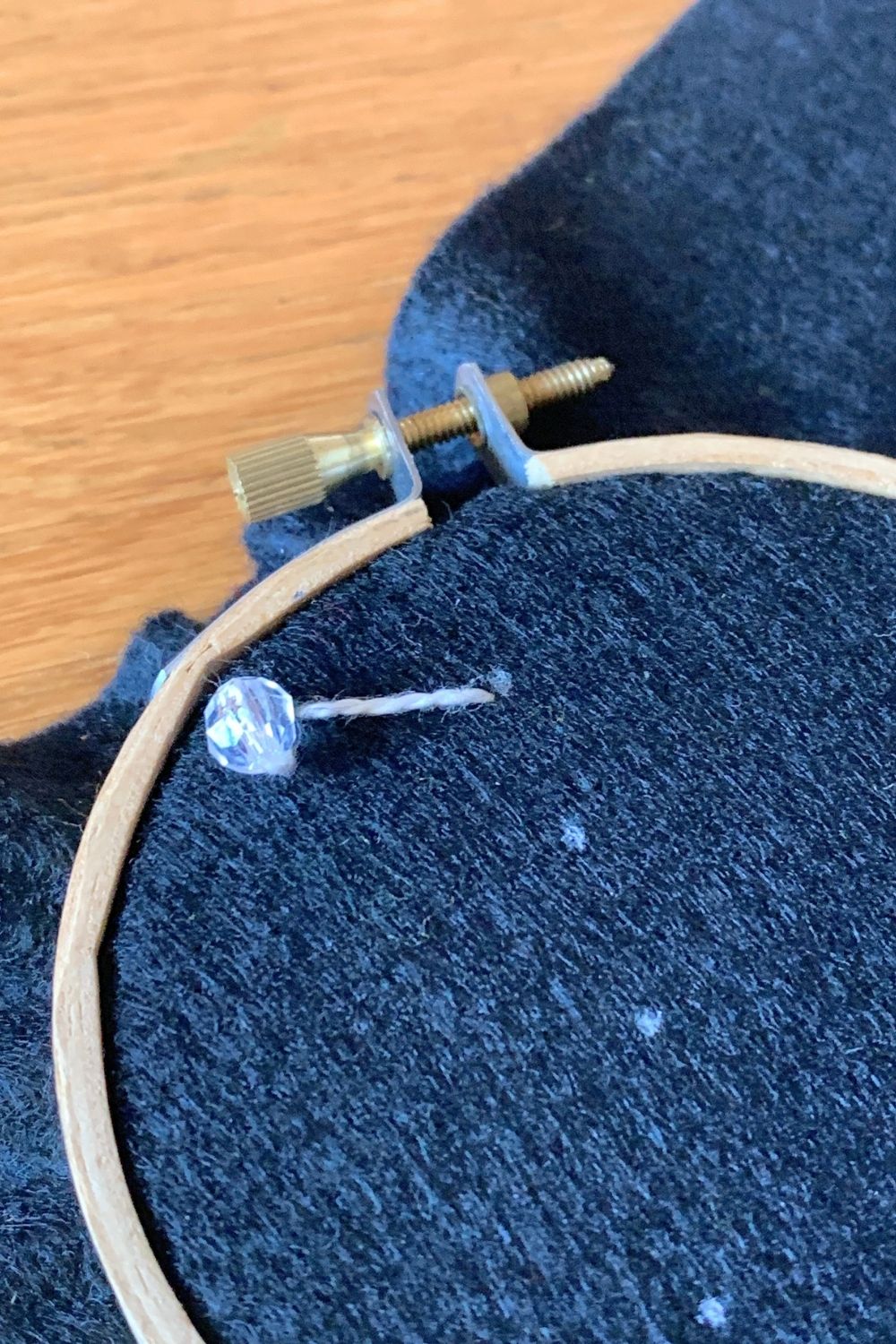 Adding a white stitch beside the bead.